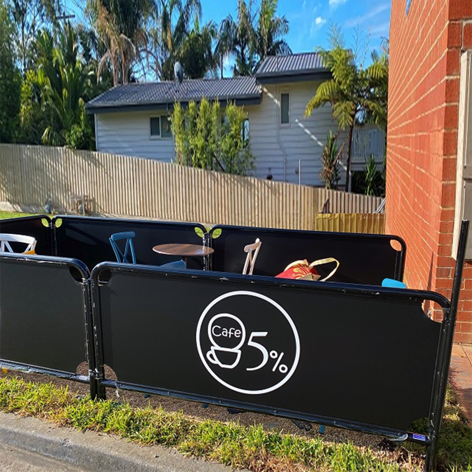 Fabric café barrier with metal frame.