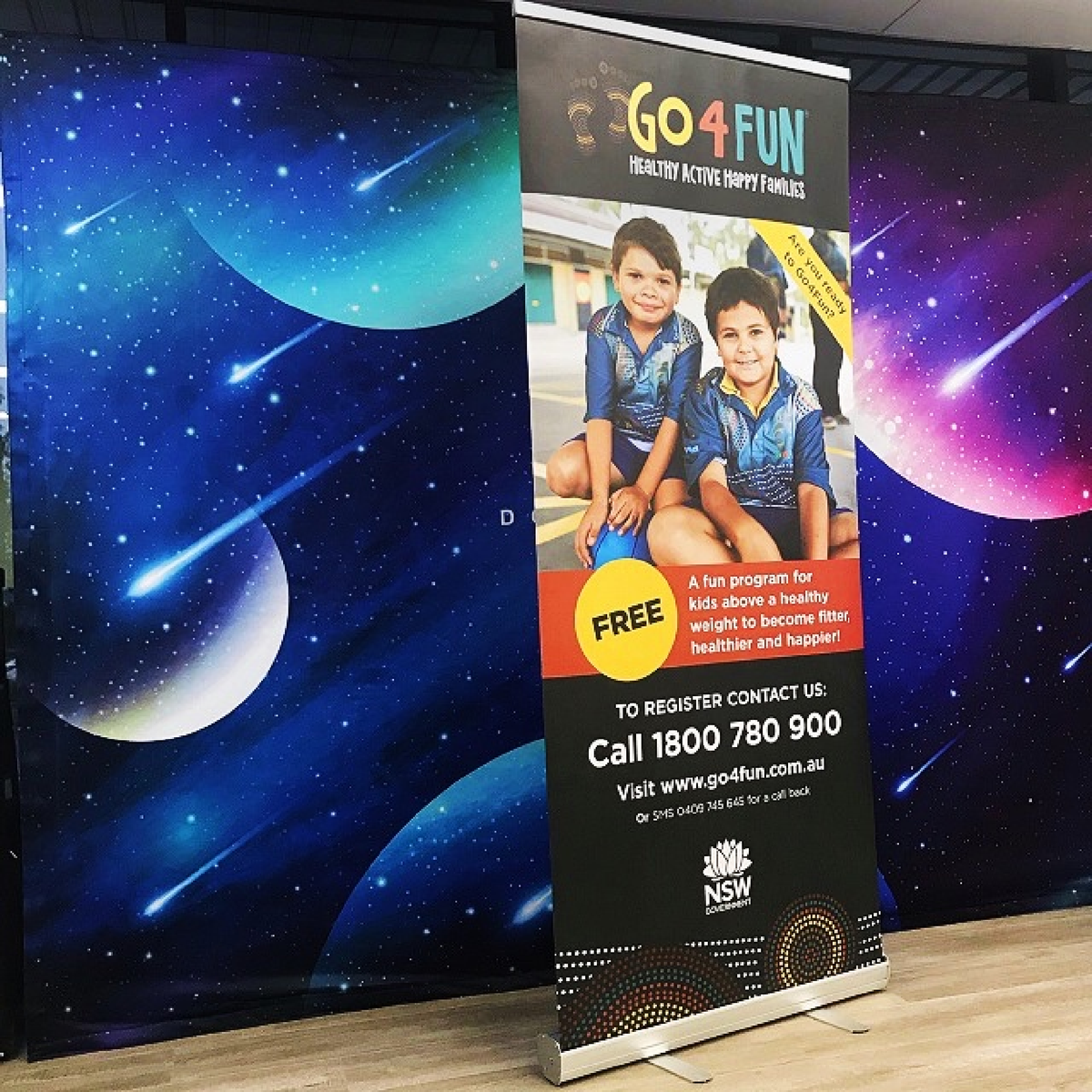 Retractable pull up banner showcasing a marketing message, ideal for trade shows and events. Lightweight aluminum base and portable design.