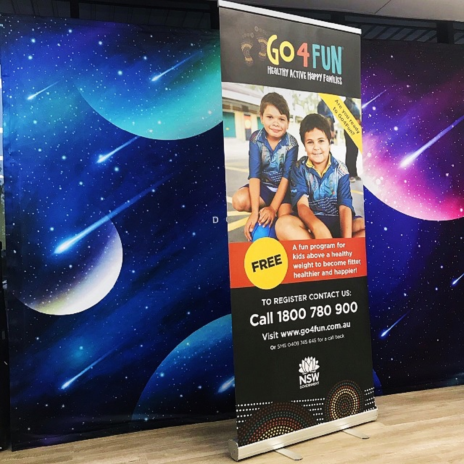 Retractable pull up banner showcasing a marketing message, ideal for trade shows and events. Lightweight aluminum base and portable design.