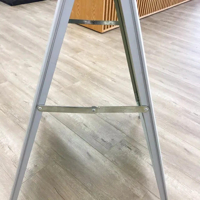 Silver snap-frame A-board sign displaying a poster.