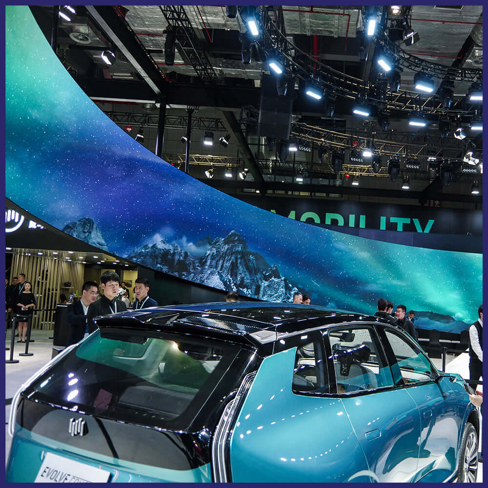 Curved LED screen displaying vibrant visuals.